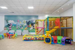 a nursery with a play room with a play set at Grand Hotel Sunny Beach - All Inclusive in Sunny Beach