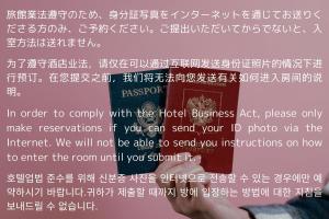 a person holding a book with white writing on it at Alaula in Izumi-Sano