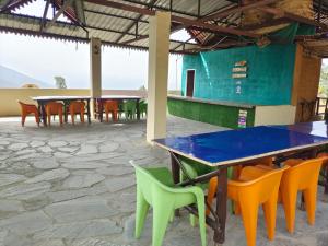 a group of tables and chairs in a room at L'Elegant Resort in Chail