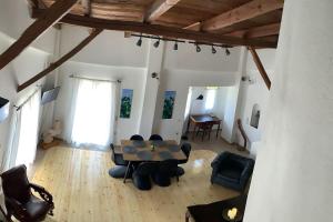 a living room with a table and chairs at Lemon tree in Filiatra