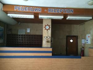 a lobby of a gym with a sign for reception at Hotel Park in Burgas