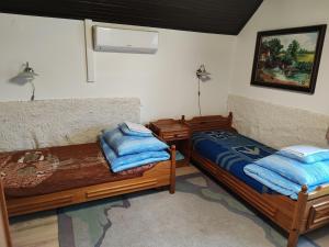 Postel nebo postele na pokoji v ubytování Malomkerék Vendégház 1. + 23 fotografií