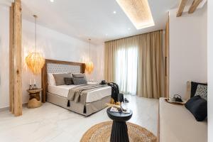 Ένα ή περισσότερα κρεβάτια σε δωμάτιο στο V Luxury Apartments Naxos