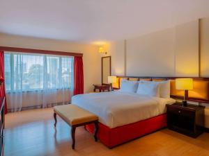 Postel nebo postele na pokoji v ubytování Mövenpick Hotel & Residences Nairobi