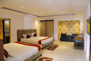 A bed or beds in a room at Panshi Inn Sylhet