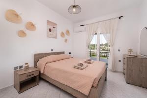 Postel nebo postele na pokoji v ubytování Afandou Panorama Apartment