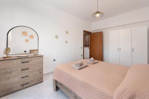 Postel nebo postele na pokoji v ubytování Afandou Panorama Apartment