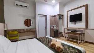 TV i/ili multimedijalni sistem u objektu The Nutshell Chalet Langkawi
