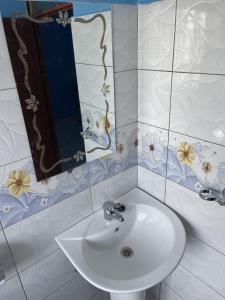a bathroom with a sink and a mirror at VILLA ESPERANZA KITUI in Kitui