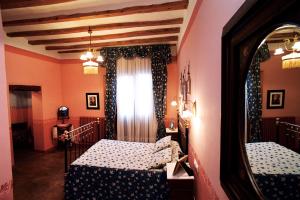 Cama o camas de una habitación en Hospederia Meson de la Dolores