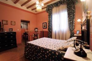 Cama o camas de una habitación en Hospederia Meson de la Dolores