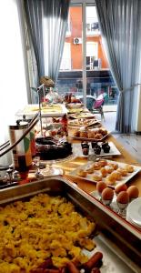 a buffet line with many different types of food at Hotel Brotas in Rimini