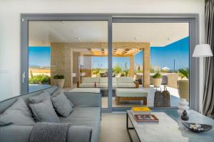a living room with a couch and a table at Brioni - Plant Villas, with luxury service in Novalja