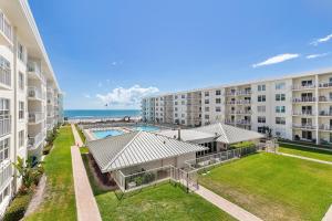 an aerial view of an apartment building with a swimming pool at Sea Coast Gardens II 316 in New Smyrna Beach