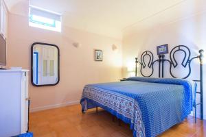 Letto o letti in una camera di La Cisterna, not only landscape