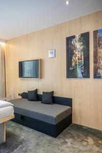 Postel nebo postele na pokoji v ubytování Hotel Plzeň + 37 fotografií