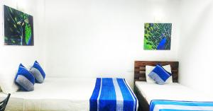 Postel nebo postele na pokoji v ubytování Ella Peace Heaven