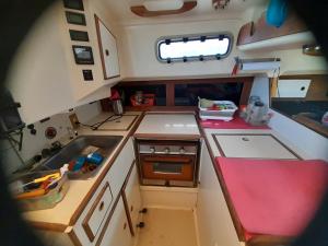 an overhead view of a kitchen in an rv at Sailboat Nika, Tilly's Sail Tours in Siaton