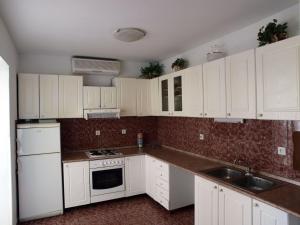 Kuchyňa alebo kuchynka v ubytovaní Vita Apartments