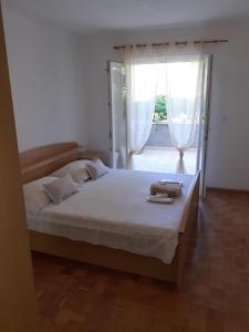 Posteľ alebo postele v izbe v ubytovaní Vita Apartments