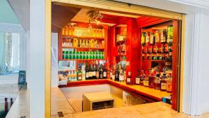 a bar with a lot of bottles of alcohol at Delamere Hotel in Blackpool