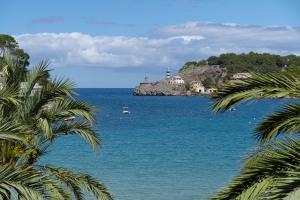 a view of a body of water with a lighthouse at Hotel Boutique Minister 4Sup in Port de Soller