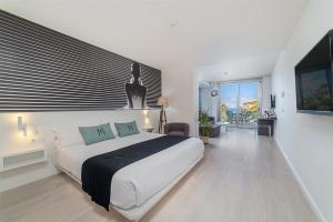 Postel nebo postele na pokoji v ubytování Hotel Boutique Minister 4Sup