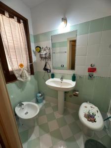 Koupelna v ubytování Isoladelmiele + 37 fotografií