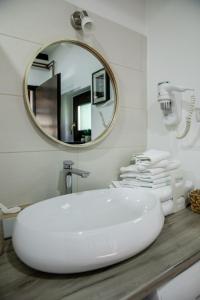 a bathroom with a white sink and a mirror at Holiday Home Međimurski Raj in Štrigova