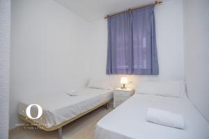 Posteľ alebo postele v izbe v ubytovaní Holiday Deluxe Magic World Playa Coral I