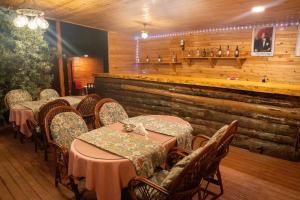 a dining room with tables and chairs in a restaurant at Obelix Bungalows in Fethiye