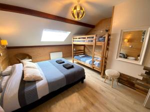 a bedroom with a bunk bed and a bunk bed at Le Carrousel 4-6p Plein centre in Gérardmer