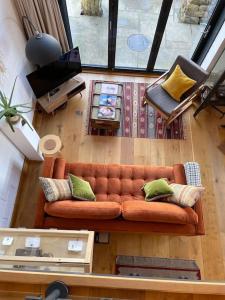 an overhead view of a living room with a couch at Springhill Studio, Brimham Rocks Yorkshire Dales in Grantley