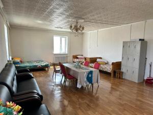 a living room with a table and a couch at Selenge in Mörön