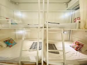 Ein Bett oder Betten in einem Zimmer der Unterkunft Chiza hostel Chiangmai