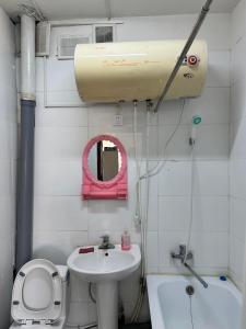 a small bathroom with a sink and a toilet at Selenge in Mörön