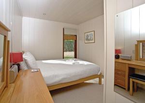 Cama ou camas em um quarto em Portmile Lodges