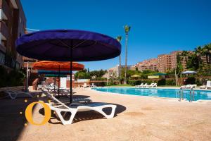 Bazén v ubytovaní Holiday Deluxe Magic World Playa Coral I alebo v jeho blízkosti