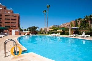 Bazén v ubytovaní Holiday Deluxe Magic World Playa Coral I alebo v jeho blízkosti