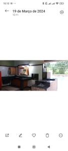 a screenshot of a kitchen with a picture of a room at Sítio São João in Pedro Leopoldo