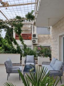 an outdoor patio with chairs and a table at Villa Ante Apartments in Blace +16 photos