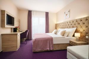 Ein Bett oder Betten in einem Zimmer der Unterkunft Hotel Stella Maris - Style & Comfort