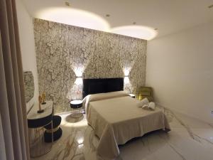 Postel nebo postele na pokoji v ubytování Luxury House Napoli Centro
