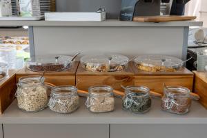 a group of jars of food in a kitchen at Hotel Continental in Caorle