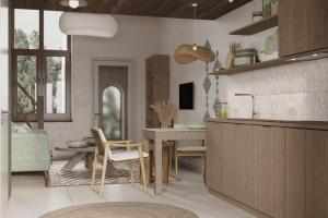 a kitchen and dining room with a table and chairs at Drevny Grad Park-hotel in Lviv