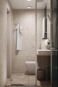 a bathroom with a shower and a toilet and a sink at Drevny Grad Park-hotel in Lviv