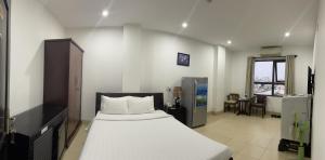 Llit o llits en una habitació de Lotus Rock Hotel Đà Nẵng
