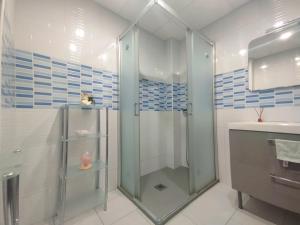 a bathroom with a shower and a sink at La Mata apartment on the first line in La Mata +23 photos