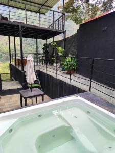 a bath tub sitting on top of a house at SAN FELIPE CASA QUINTA in Ibagué