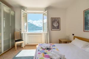 Ένα ή περισσότερα κρεβάτια σε δωμάτιο στο Apartment Daniela - San Siro +20 φωτογραφίες
